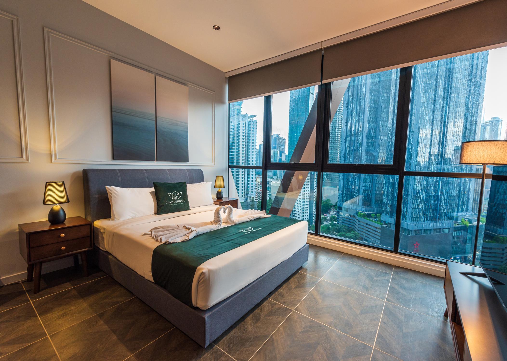 MapleHome-managed bedroom with Kuala Lumpur skyline view